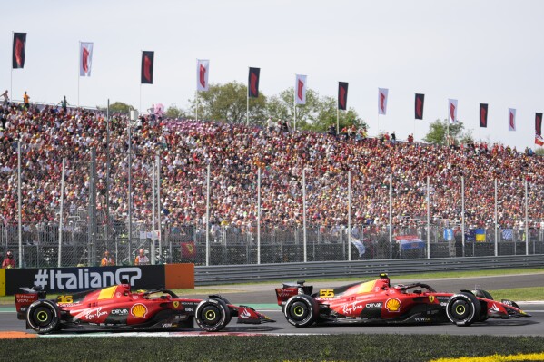 Ferrari driver Charles Leclerc of Monaco, left, and Ferrari driver Carlos Sainz of Spain steer their cars during the Formula One Italian Grand Prix auto race, at the Monza racetrack, in Monza, Italy, Sunday, Sept. 3, 2023. (AP Photo/Luca Bruno)