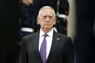 
              In this Tuesday, Aug. 15, 2017, file photo, U.S. Defense Secretary Jim Mattis stands as he waits for Netherlands Minister of Defense Jeanine Hennis-Plasschaert during an enhanced honor cordon at the Pentagon in Washington. U.S. As Mattis arrived in Baghdad Tuesday, he said says Islamic State militants are caught in a military vise that will squeeze them from both ends of the Euphrates River valley that bisects Iraq and Syria. (AP Photo/Alex Brandon)
            