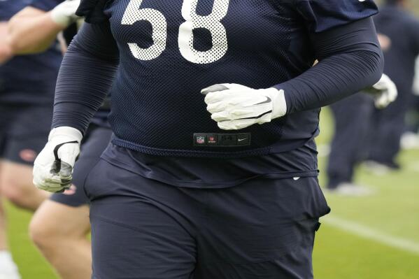 Chicago Bears offensive lineman Darnell Wright warms up during the NFL football team's rookie minicamp at Halas Hall in Lake Forest, Ill., Saturday, May 6, 2023. (AP Photo/Nam Y. Huh)