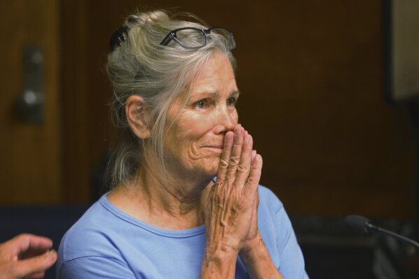 FILE - In this Sept. 6, 2017, file photo, Leslie Van Houten reacts after hearing she is eligible for parole during a hearing at the California Institution for Women in Corona, Calif. A California panel has recommended parole for Charles Manson follower Van Houten, who has spent nearly five decades in prison. The recommendation was made Thursday, July 23, 2020, although Gov. Gavin Newsom could decide to deny it. (Stan Lim/Los Angeles Daily News via AP, Pool, File)