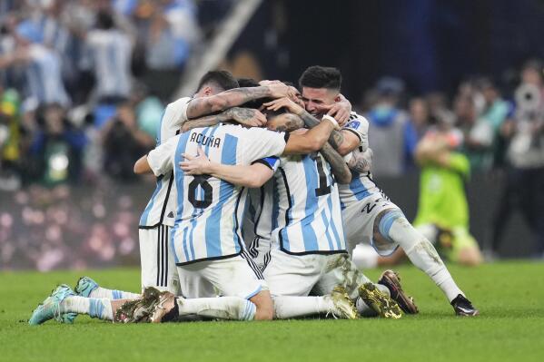 Argentina players celebrate winning the World Cup final soccer match between Argentina and France at the Lusail Stadium in Lusail, Qatar, Sunday, Dec.18, 2022. (AP Photo/Manu Fernandez)