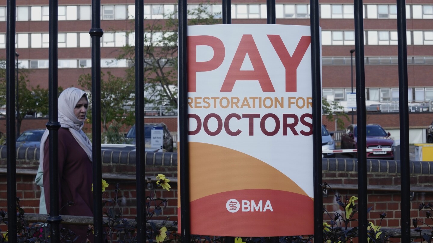 Senior doctors in England vote to accept improved government pay deal, ending year-long dispute