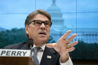 FILE - In this May 9, 2019 file photo, Energy Secretary Rick Perry testifies before the House Energy and Commerce Committee on his future budget request, on Capitol Hill in Washington. (AP Photo/J. Scott Applewhite)