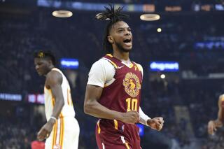 FILE - Cleveland Cavaliers' Darius Garland (10) reacts to a basket during the first half of the team's NBA play-in basketball game against the Atlanta Hawks on Friday, April 15, 2022, in Cleveland. Cavaliers All-Star guard Darius Garland has agreed to a five-year, $193 million contract extension with Cleveland, his agent Rich Paul said Saturday, July 2, 2022. Garland's deal is the largest in franchise history. (AP Photo/Nick Cammett, File)
