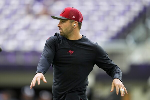 Tampa Bay Buccaneers quarterback Baker Mayfield warms up before an NFL football game against the Minnesota Vikings, Sunday, Sept. 10, 2023, in Minneapolis. (AP Photo/Abbie Parr)