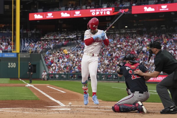 Philadelphia Phillies' Bryce Harper is hit by a pitch Atlanta Braves' Spencer Strider during a baseball game, Tuesday, May 27, 2025, in Philadelphia. (AP Photo/Matt Slocum)