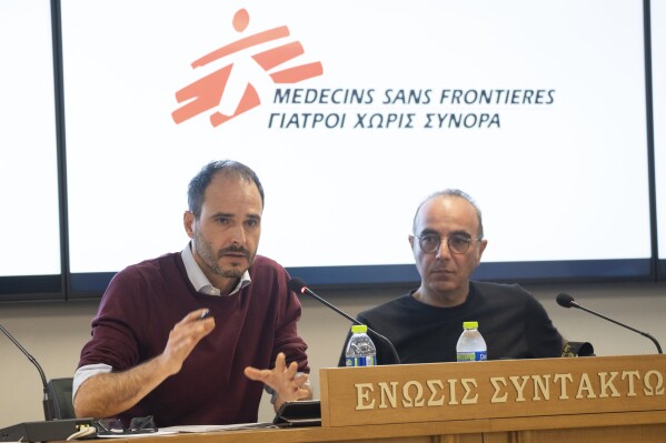 International President of MSF Christos Christou, left, speaks next to Greek journalist Panos Charitos, during a news conference organised by the Doctors Without Borders, in Athens, on Thursday, Nov. 2, 2023. A leading international medical charity says it has received scores of testimonies over the past two years from migrants that point to a 