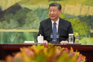 FILE - Chinese President Xi Jinping talks to U.S. Secretary of State Antony Blinken at the Great Hall of the People, on April 26, 2024, in Beijing, China. Chinese President Xi Jinping will visit France, Serbia and Hungary next week as Beijing appears to seek a larger role in the conflict between Russia and Ukraine that has upended global political and economic security, China's foreign ministry said Monday, April 29. (AP Photo/Mark Schiefelbein, Pool, File)