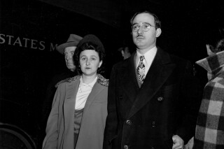 Julius Rosenberg and his wife, Ethel, arrive at Federal Courthouse for their espionage trial in New York City on March 21, 1951.   The Rosenbergs, tried under the Espionage Act of 1917, are two of three defendants charged with conspiracy to spy for the Soviet Union.  (AP Photo)