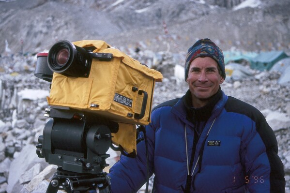 This photo provided by Arcturus Motion Pictures, Inc., shows Mountaineer, filmmaker and author David Breashears while filming the IMAX documentary “Everest” that premiered in 1998. Breashears, 68, died on Thursday, March 14, 2024 at his home in Marblehead, Mass. (Arcturus Motion Pictures, Inc. via AP)