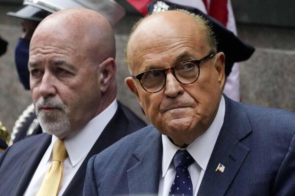 FILE - This photo from Friday Sept. 11, 2020, shows former New York Mayor Rudolph Giuliani, right, and former New York City police Commissioner Bernard Kerik, left, during the Tunnel to Towers ceremony in New York. Kerik, a longtime Giuliani friend who was pardoned by former President Donald Trump for felony convictions, said Giulani called him as federal agents were searching his home on Wednesday, April 28, 2021. (AP Photo/Mark Lennihan, File)