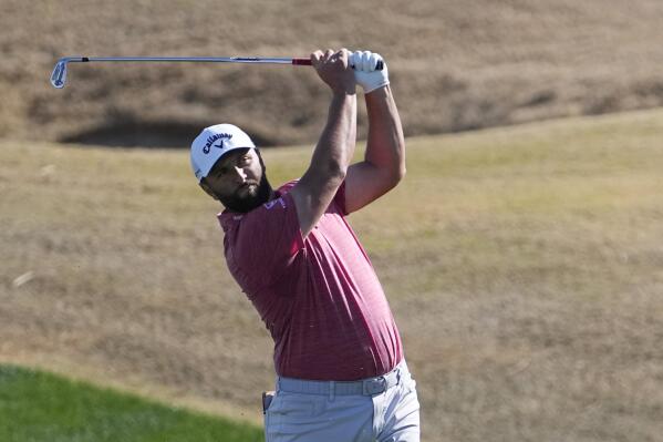 Jon Rahm hits from the fairway on the third hole during the final round of the American Express golf tournament on the Pete Dye Stadium Course at PGA West Sunday, Jan. 22, 2023, in La Quinta, Calif. (AP Photo/Mark J. Terrill)