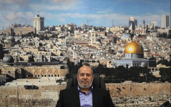 Khalil al-Hayya, a high-ranking Hamas official who has represented the Palestinian militant group in negotiations for a cease-fire and hostage exchange deal, sits in front of a backdrop showing the old city of Jerusalem during an interview with The Associated Press, in Istanbul, Turkey, Wednesday, April 24, 2024. (AP Photo/Khalil Hamra)