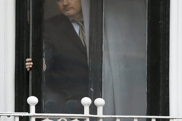 
              FILE - In this file photo dated Friday, Feb. 5, 2016, Wikileaks founder Julian Assange steps onto the balcony of the Ecuadorean Embassy in London, preparing to address supporters and the media.  Swedish prosecutors are to reopen rape case against WikiLeaks founder Julian Assange, a month after he was removed from the Ecuadorian Embassy in London. (AP Photo/Kirsty Wigglesworth, File)
            