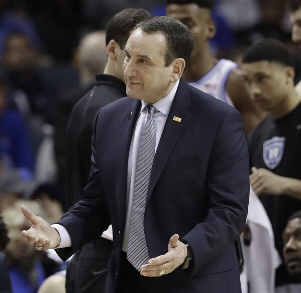 
              Duke head coach Mike Krzyzewski questions a call against Florida State during the first half of the NCAA college basketball championship game of the Atlantic Coast Conference tournament in Charlotte, N.C., Saturday, March 16, 2019. (AP Photo/Chuck Burton)
            