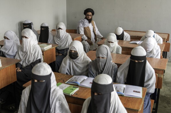 FILE - Afghan girls attend a religious school, which remained open since the last year's Taliban takeover, in Kabul, Afghanistan, on Aug. 11, 2022. Two years after the Taliban banned girls from school beyond sixth grade, Afghanistan is the only country in the world with restrictions on female education. Now, the rights of Afghan women and children are on the agenda of the United Nations General Assembly Monday, Sept. 18, 2023, in New York. (AP Photo/Ebrahim Noroozi, File)