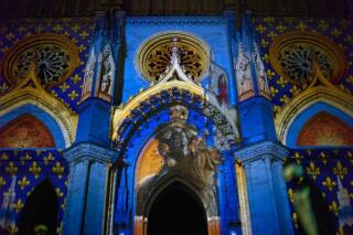 An artistic projection showing Joan of Arc is seen at Orlean's cathedral during ceremonies marking the 600th anniversary of the birth of Joan of Arc, in Orleans, central France, Sunday April 29, 2012. The city of Orleans goes all out with celebrations marking the 600th birthday of Joan of Arc, a national icon and symbol of French resistance through the ages at a time when French identity and France's role in the world are a focus in the presidential campaign. (AP Photo/Thibault Camus)