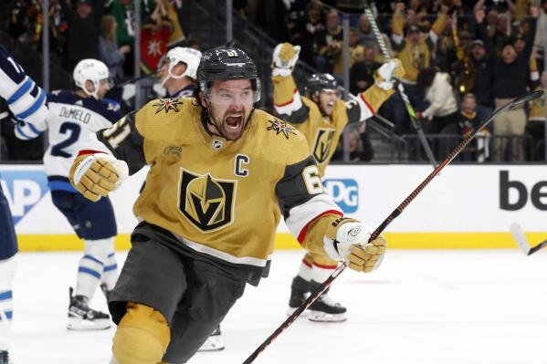 Vegas Golden Knights right wing Mark Stone (61) celebrates his second goal against the Winnipeg Jets in the third period of Game 2 in an NHL hockey Stanley Cup first-round playoff series Thursday, April 20, 2023, in Las Vegas. (Steve Marcus/Las Vegas Sun via AP)