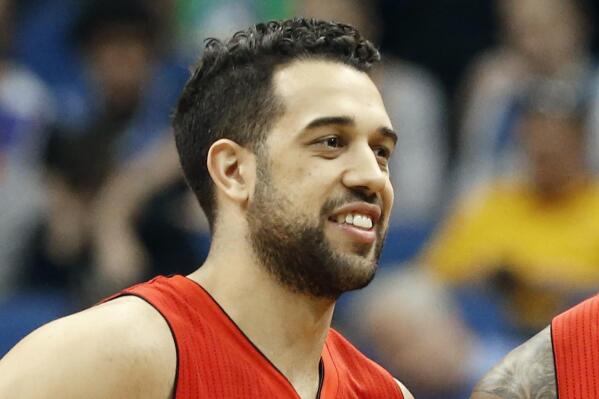FILE - Toronto Raptors' Landry Fields smiles during a break in the second half of an NBA basketball game against the Minnesota Timberwolves, Wednesday, April 1, 2015, in Minneapolis. Atlanta Hawks new general manager, Landry Fields, says team president Travis Schlenk is still the decision-maker as the Hawks approach Thursday's, June 23, 2022, NBA draft. (AP Photo/Jim Mone, File)