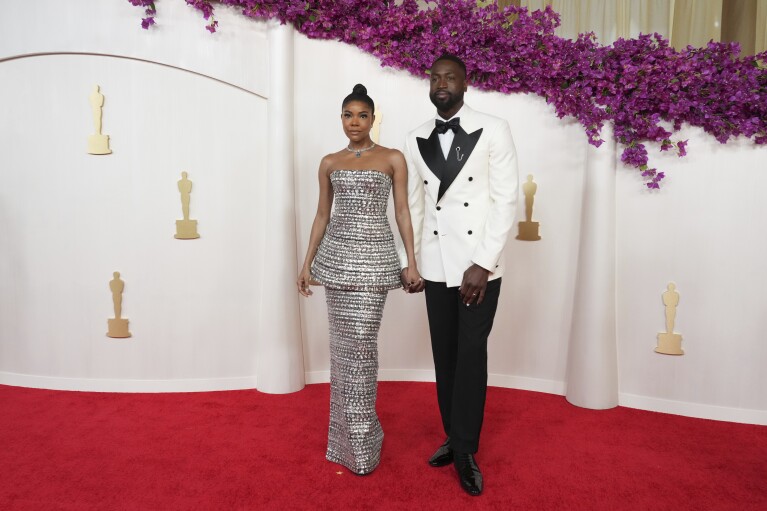 Gabrielle Union, left, and Dwayne Wade arrive at the Oscars on Sunday, March 10, 2024, at the Dolby Theatre in Los Angeles. (Photo by Jordan Strauss/Invision/AP)