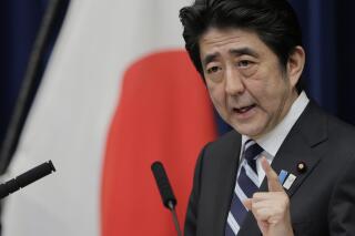 FILE - Then Japanese Prime Minister Shinzo Abe speaks during a news conference in Tokyo, Friday, March 15, 2013. Former Japanese Prime Minister Abe died after being shot during a campaign speech Friday, July 8, 2022, in western Japan. He did not tweet about Hillary Clinton the day before he died, and a screenshot purporting to show such a tweet is fabricated.
(AP Photo/Itsuo Inouye, File)
