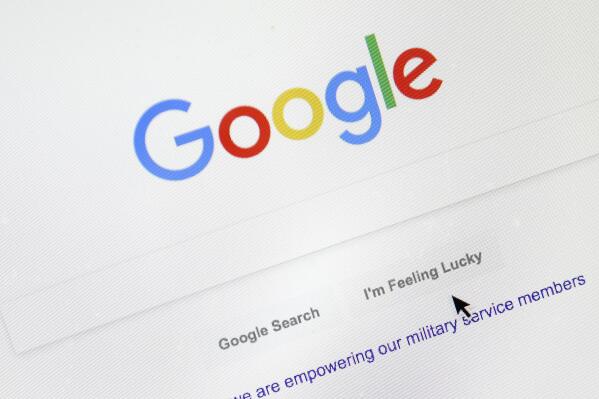FILE - A cursor moves over Google's search engine page on Aug. 28, 2018, in Portland, Ore. The company built on quickly finding answers to people's questions suddenly finds itself grappling for a response to a form of artificial intelligence that long-time rival Microsoft is now deploying to attack its dominant search engine. Microsoft's assault combined with concerns Google's ability to ward it off contributed to a nearly 8% decline in the stock price of Google's corporate parent Wednesday, Feb. 8, 2023, in a selloff that wiped out more than $100 billion in shareholder wealth. (AP Photo/Don Ryan, File)