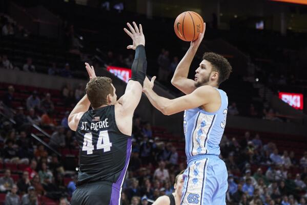 North Carolina forward Pete Nance, right, shoots over Portland center Joey St. Pierre during the first half of an NCAA college basketball game in the Phil Knight Invitational tournament in Portland, Ore., Thursday, Nov. 24, 2022. (AP Photo/Craig Mitchelldyer)