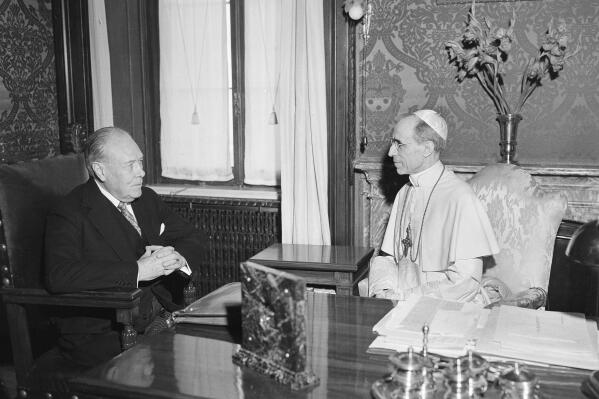 FILE - President Truman's envoy to the Vatican, Myron C. Taylor, left, has an audience with Pope Pius XII at Castelgandolfo near Rome, on Aug. 26, 1947. The Vatican has long defended its World War II-era pope, Pius XII, against criticism that he remained silent as the Holocaust unfolded, insisting that he worked quietly behind the scenes to save lives. Pulitzer Prize-winning author David Kertzer’s “The Pope at War,” which comes out Tuesday, June 7, 2022 in the United States, citing recently opened Vatican archives, suggests the lives the Vatican worked hardest to save were Jews who had converted to Catholicism or were children of Catholic-Jewish “mixed marriages.” (AP Photo/Luigi Felici, File)