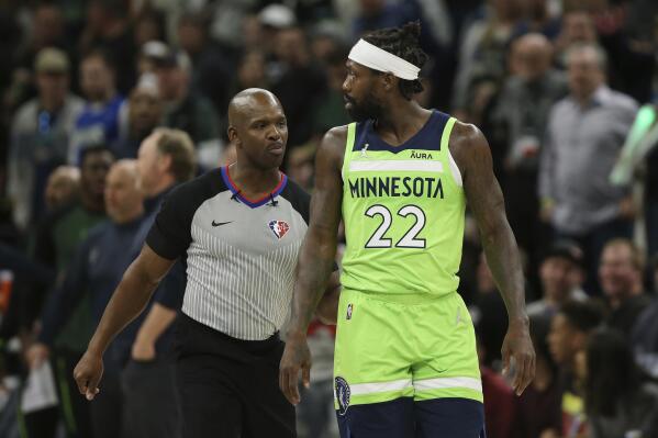 Minnesota Timberwolves guard Patrick Beverley (22) walks off the court after being ejected during the first half of an NBA basketball game against the Milwaukee Bucks, Saturday, March 19, 2022, in Minneapolis. (AP Photo/Stacy Bengs)
