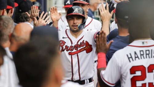 Atlanta Braves' Travis d'Arnaud, center, celebrates with teammates after hitting a two-run home run against the Miami Marlins during the eighth inning of a baseball game Sunday, July 2, 2023, in Atlanta. (AP Photo/Alex Slitz)