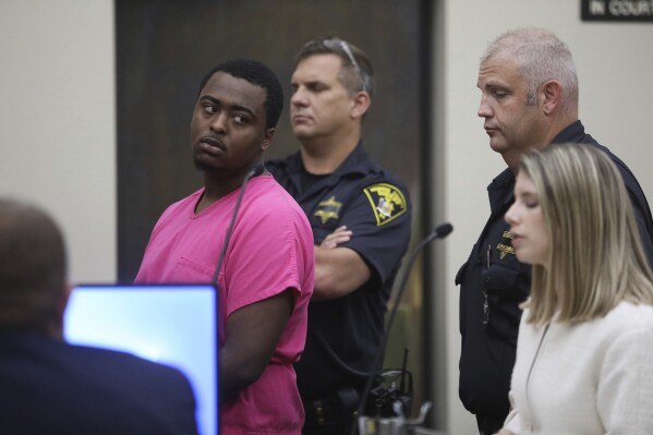 FILE - Kelvin Vickers, 21, left, is arraigned in Rochester City Court in Rochester, N.Y., on Saturday, July 23, 2022. Vickers, a man who authorities say killed an upstate New York police officer and wounded another cop in an ambush after having fatally shot two other people during a three-day spree of violence last year was convicted Friday, Oct. 13, 2023 of multiple murder charges and other crimes. (Tina MacIntyre-Yee/Democrat & Chronicle via AP, File)