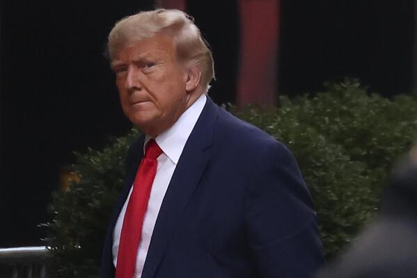 Former President Donald Trump arrives at Trump Tower, Monday, April 3, 2023, in New York. Trump arrived in New York on Monday for his expected booking and arraignment the following day on charges arising from hush money payments during his 2016 campaign. (AP Photo/Yuki Iwamura)