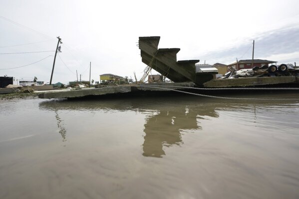 Stair steps and a slab are left behind in the wake of Hurricane Laura, Thursday, Aug. 27, 2020, in Holly Beach, La. (AP Photo/Eric Gay)