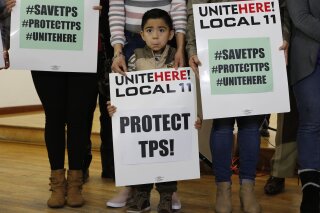 FILE - In this Jan. 8, 2018, file photo, Mateo Barrera, 4, originally from El Salvador, whose family members benefit from Temporary Protected Status attends a news conference in Los Angeles. The Tr...