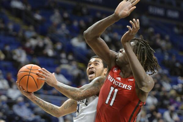 Penn State's Sam Sessoms (3) drives to the basket on Rutgers Clifford Omoruyi (11) in the first half of an NCAA college basketball game Tuesday, Jan 11, 2022, in State College, Pa. (AP Photo/Gary M. Baranec)