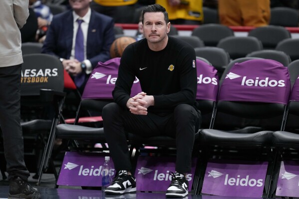 Los Angeles Lakers head coach JJ Redick looks on before an NBA basketball game against the Washington Wizards, Thursday, Jan. 30, 2025, in Washington. (AP Photo/Jess Rapfogel)