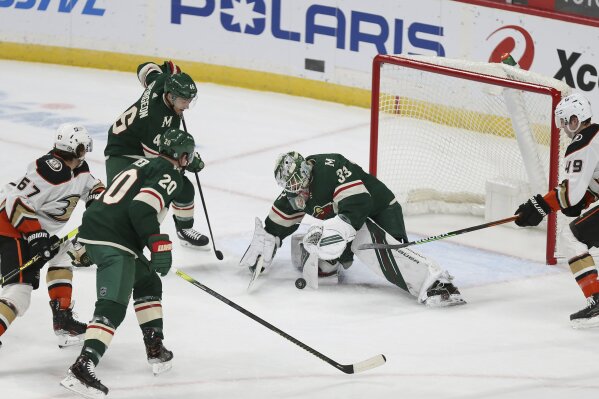 Minnesota Wild's goalie Cam Talbot (33) stops the puck against the Anaheim Ducks during the first period of an NHL hockey game Monday, March 22, 2021, in St. Paul, Minn. (AP Photo/Stacy Bengs)