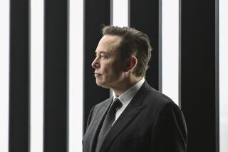 FILE - Elon Musk, Tesla CEO, attends the opening of the Tesla factory Berlin Brandenburg in Gruenheide, Germany, March 22, 2022. Elon Musk will be able to include new evidence from a Twitter whistleblower as he fights to get out of his $44 billion deal to buy the social media company, but Musk won’t be able to delay a high-stakes October trial over the dispute, a judge ruled Wednesday, Sept. 7, 2022. (Patrick Pleul/Pool via AP)