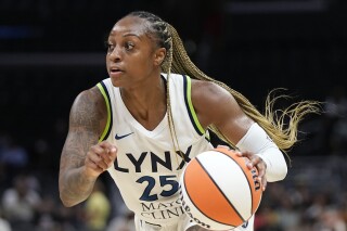 FILE Minnesota Lynx guard Tiffany Mitchell dribbles during the first half of a WNBA basketball game against the Los Angeles Sparks Tuesday, June 20, 2023, in Los Angeles. South Carolina will retire the No. 25 jersey of two-time Southeastern Conference player of the year Tiffany Mitchell. The 5-foot-10 Mitchell, from Charlotte, N.C., will be honored Nov. 12, 2023, prior to tipoff of the Gamecocks home contest with Maryland. (AP Photo/Mark J. Terrill, File)