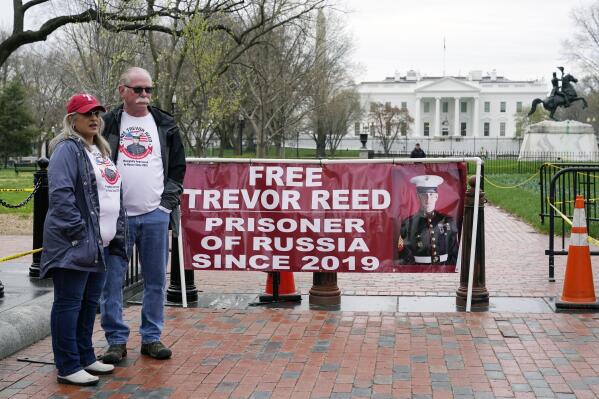 Joey and Paula Reed, parents of U.S. Marine Corps veteran and Russian prisoner Trevor Reed, stand in Lafayette Park near the White House, Wednesday, March 30, 2022, in Washington. The Reeds are urging President Joe Biden to advocate for their son's release from his nine-year prison term on charges alleging that he assaulted police officers in Moscow. (AP Photo/Patrick Semansky)