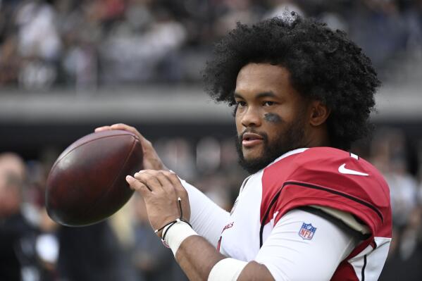 FILE - Arizona Cardinals quarterback Kyler Murray warms up on the sideline during the first half of an NFL football game against the Las Vegas Raiders Sunday, Sept. 18, 2022, in Las Vegas. Police in Las Vegas say they're investigating allegations that a fan struck Murray amid celebrations of Arizona's 29-23 overtime victory over the Raiders. (AP Photo/David Becker, File)