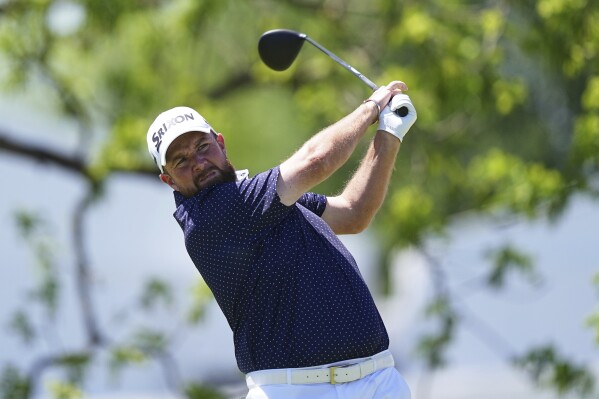Shane Lowry, of Ireland, hits on the first hole during the third round of the Truist Championship golf tournament at the Philadelphia Cricket Club, Saturday, May 10, 2025, in Flourtown. (AP Photo/Matt Rourke)