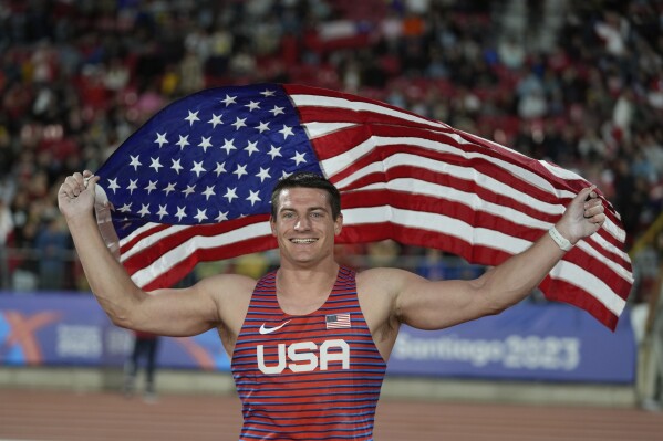 Matthew Ludwig of the United States celebrates winning the gold medal in the men's pole vault final at the Pan American Games in Santiago, Chile, Saturday, Nov. 4, 2023. (AP Photo/Fernando Vergara)