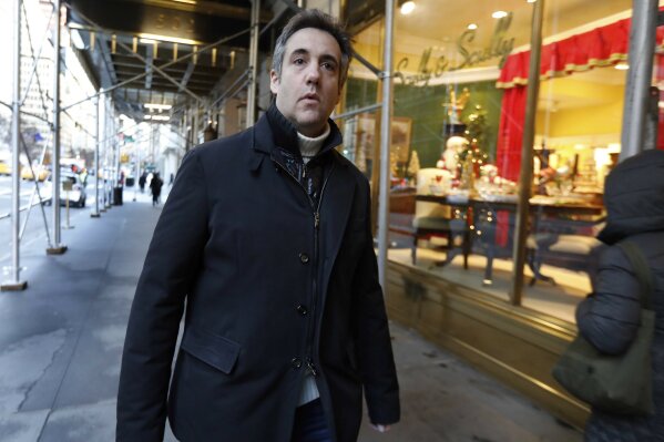 
              FILE - In this Dec. 7, 2018 file photo, Michael Cohen, former lawyer to President Donald Trump, leaves his apartment building on New York's Park Avenue. (AP Photo/Richard Drew)
            