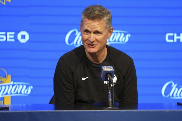 FILE - Golden State Warriors head coach Steve Kerr talks to media members before an NBA basketball game against the New Orleans Pelicans, March 28, 2023, in San Francisco. Kerr has no concerns about his long-term status of coach of the Warriors despite heading into the final year of his contract. (AP Photo/Darren Yamashita, File)