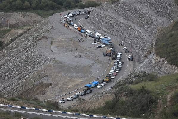 FILE - Ethnic Armenians flee Nagorno-Karabakh to Kornidzor, in Armenia's Syunik region, Tuesday, Sept. 26, 2023. Armenia and Azerbaijan have agreed to exchange prisoners of war and work toward signing a peace treaty in what the European Union is hailing as a major step toward peace in the long-troubled region. The two countries said in a joint statement Thursday, Dec. 7, 2023 that they “share the view that there is a historical chance to achieve a long-awaited peace.” (APPhoto/Vasily Krestyaninov, File)