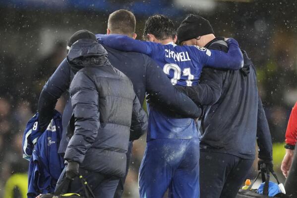 Chelsea's Ben Chilwell is helped from the pitch after sustaining an injury during the Champions League group E soccer match between Chelsea and Dinamo Zagreb at Stamford Bridge stadium In London, Wednesday, Nov. 2, 2022. (AP Photo/Frank Augstein)