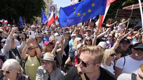 Participants join an anti-government march led by the centrist opposition party leader Donald Tusk, who along with other critics accuses the government of eroding democracy, in Warsaw, Poland, Sunday, June 4, 2023. Poland's largest opposition party led a march Sunday meant to mobilize voters against the right-wing government, which it accuses of eroding democracy and following Hungary and Turkey down the path to autocracy. The march is being held on the 34th anniversary of the first partly free elections, a democratic breakthrough in the toppling of communism across Eastern Europe. (AP Photo/Czarek Sokolowski)