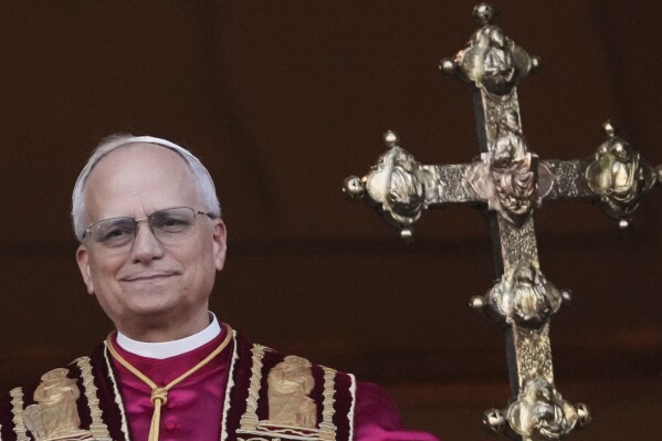 Newly elected Pope Leo XIV appears at the balcony of St. Peter's Basilica at the Vatican, Thursday, May 8, 2025. (AP Photo/Alessandra Tarantino)