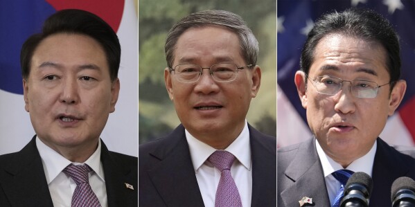 In this combination photos, South Korean President Yoon Suk Yeol, left, makes some remarks to the media in London on Nov. 22, 2023, Chinese Premier Li Qiang, center, waits at the Great Hall of the People in Beijing on April 7, 2024, and Japanese Prime Minister Fumio Kishida speaks in Washington on April 10, 2024. Leaders of South Korea, China and Japan will meet next week in Seoul for their first trilateral talks since 2019, South Korea's presidential office announced Thursday, May 23, 2024. (AP Photo, File)